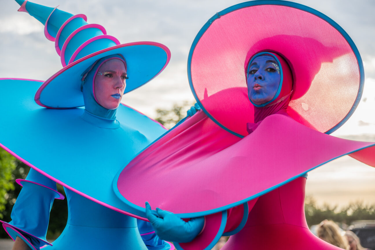 Two ladies dressed in helter skelter silt walker costumes