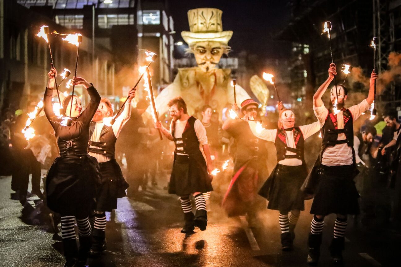 Fire performers parading through Paisley Halloween Festival 2019