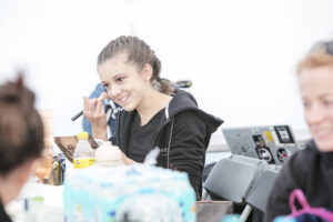 A performer applies make-up backstage. Portolan, Sunderland Tall Ships, Cirque Bijou. Image Dan Prince.