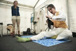 Wire walkers Johanne Humblet and Chris Bullzini warm-up and prepare backstage. Portolan, Sunderland Tall Ships, Cirque Bijou. Image Dan Prince.