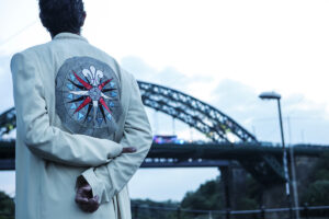 Wire walker Chris Bullzini looks towards the Wearmouth Bridge. Portolan, Sunderland Tall Ships, Cirque Bijou. Image Dan Prince.