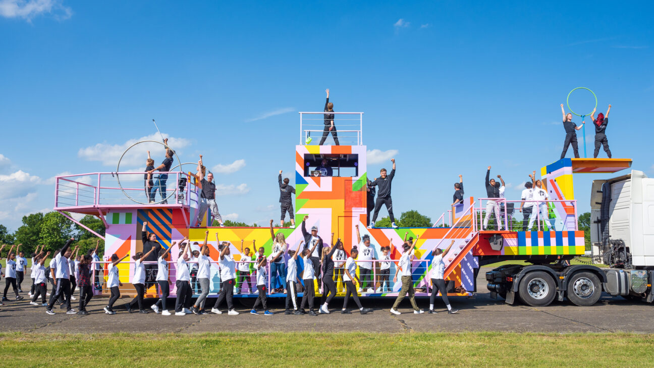 A group shot of our performers for the Queens jubilee pageant, standing in front of our beautifully decorated float