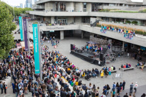 Extraordinary Bodies' What Am I Worth? audience gather at National Theatre River Stage, image Rob Harris. 