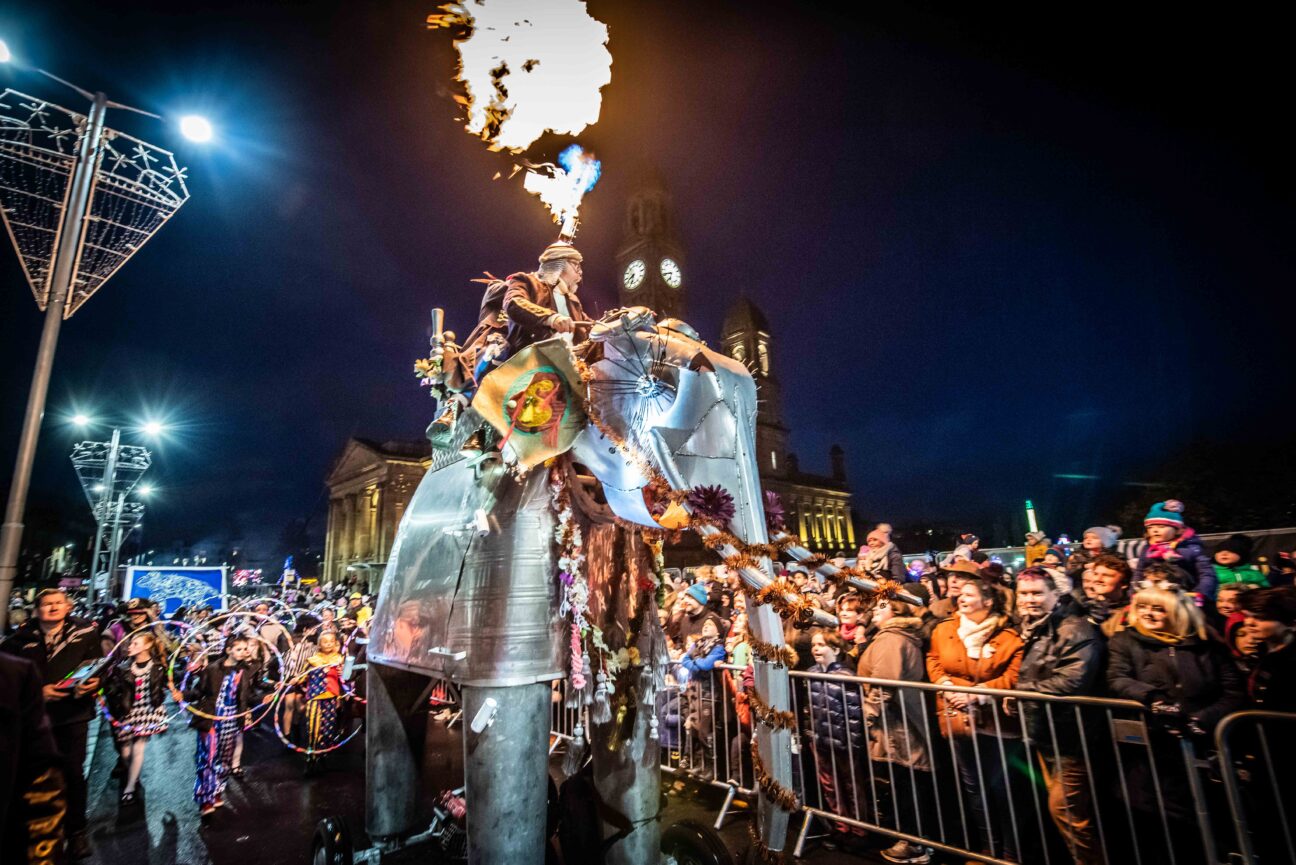 Large elephant puppet parades through the streets of Paisley, with audience members watching with delight