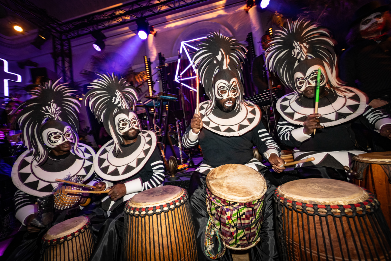 Voodoo Halloween, drummers wearing black and white voodoo costumes.