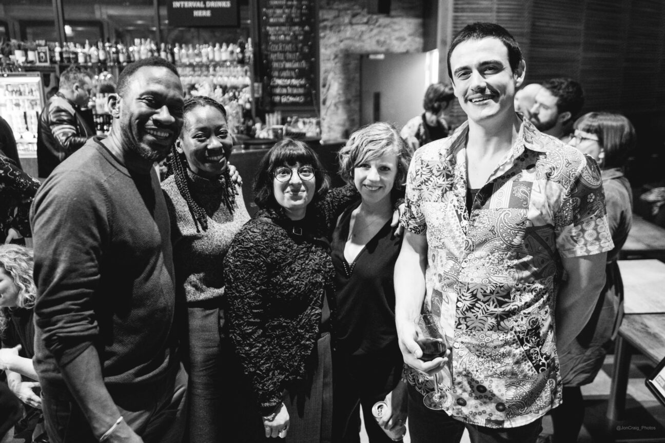 Geraldine stands with a group of people, smiling at the camera at the Waldos premier at Bristol Old Vic